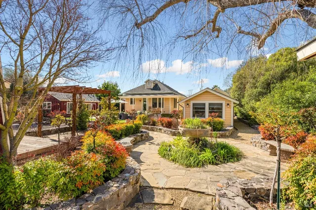 a front view of a house with garden