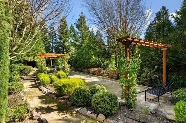 a living room with furniture kitchen view and a dining table