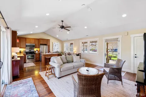 a bathroom with a sink vanity tub and a mirror