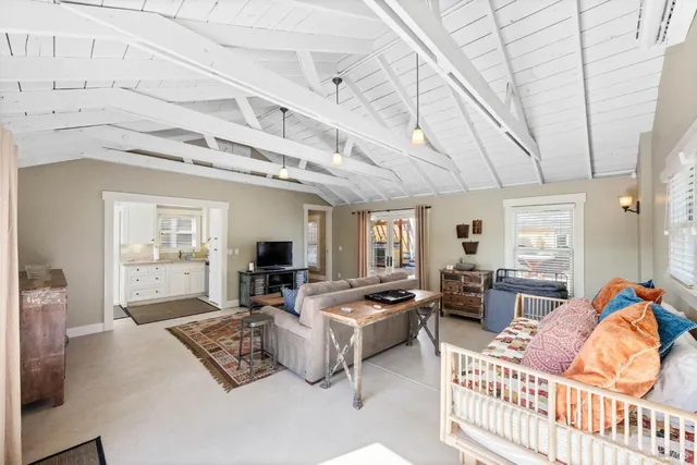 a view of a swimming pool and lounge chairs