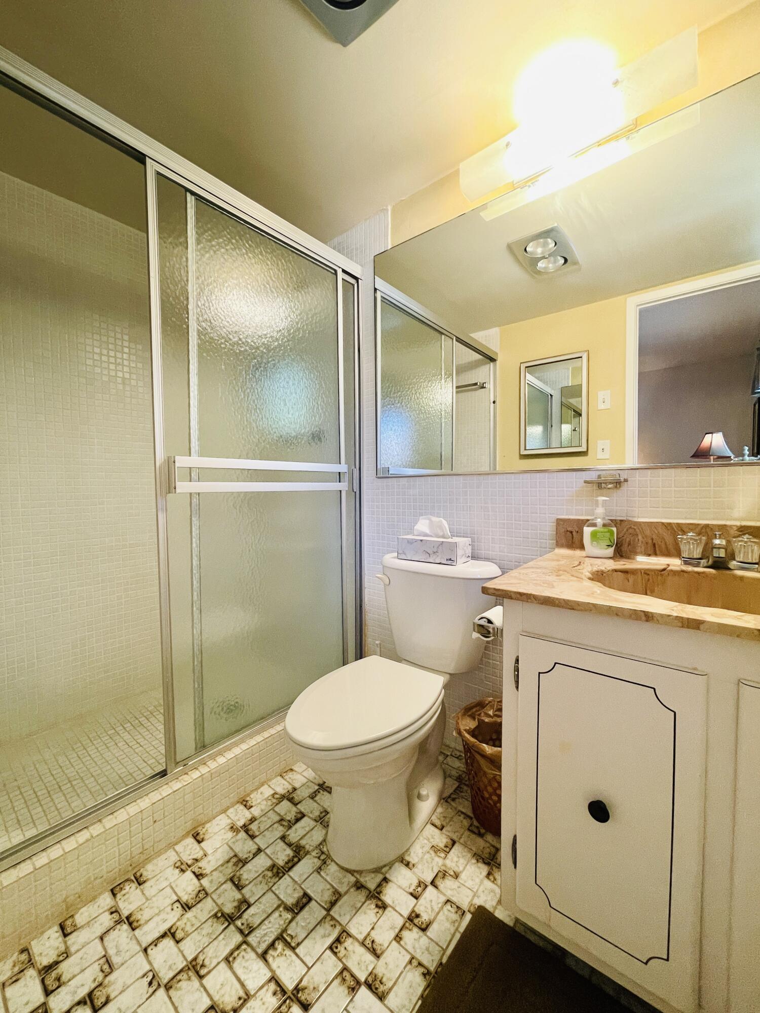257 South Cypress Road, Unit 442 Pompano Beach, FL 33060 - Photo 18 of 37 a bathroom with a sink toilet and shower