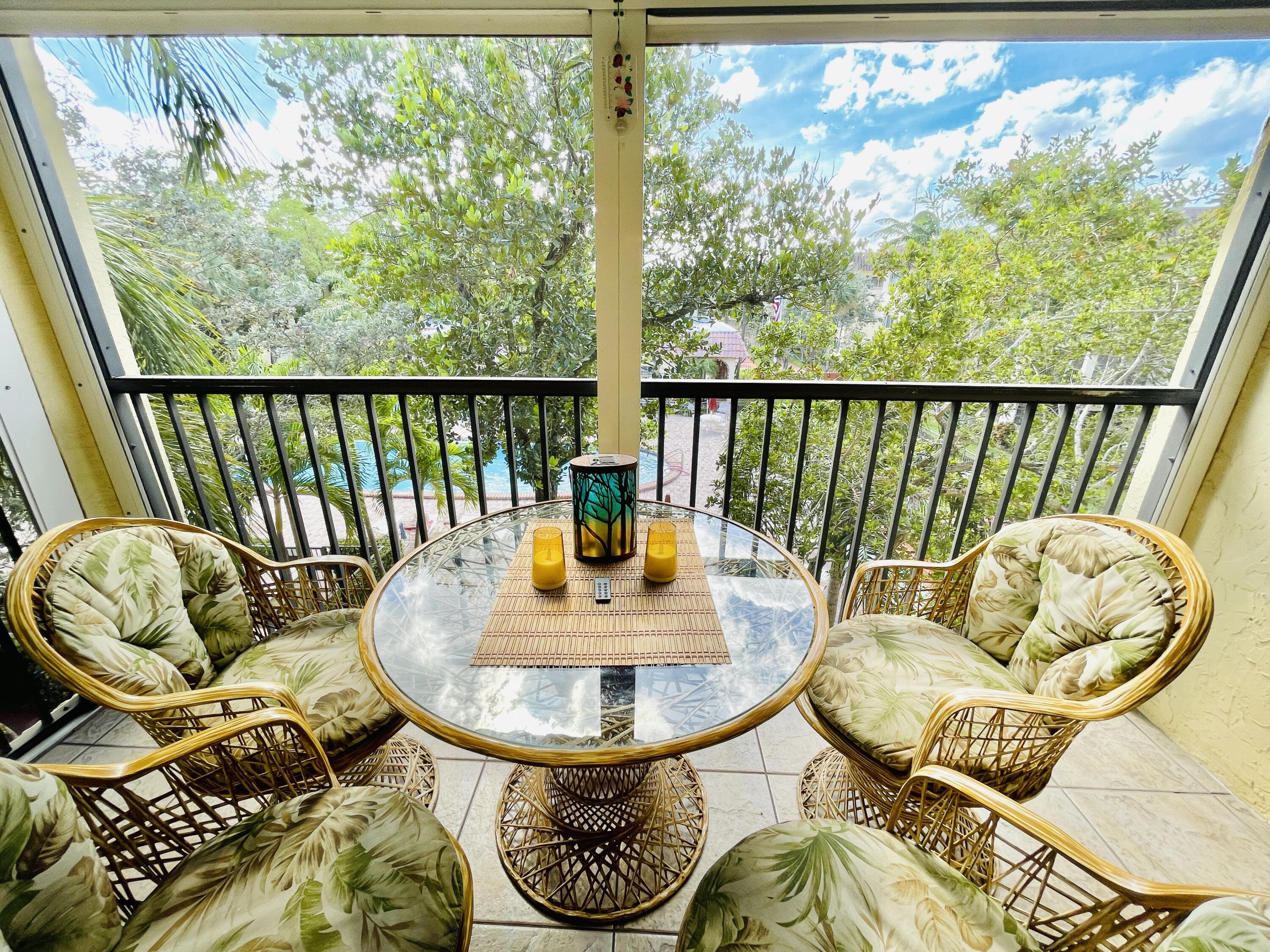 257 South Cypress Road, Unit 442 Pompano Beach, FL 33060 - Photo 20 of 37 a view of a dining room with furniture window and outside view