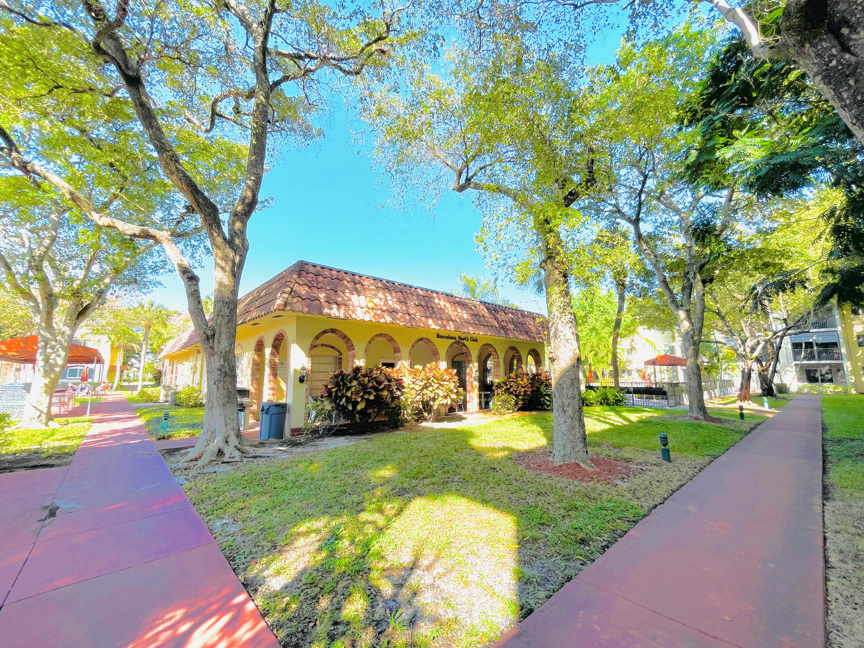 257 South Cypress Road, Unit 442 Pompano Beach, FL 33060 - Photo 24 of 37 a view of a park with large trees