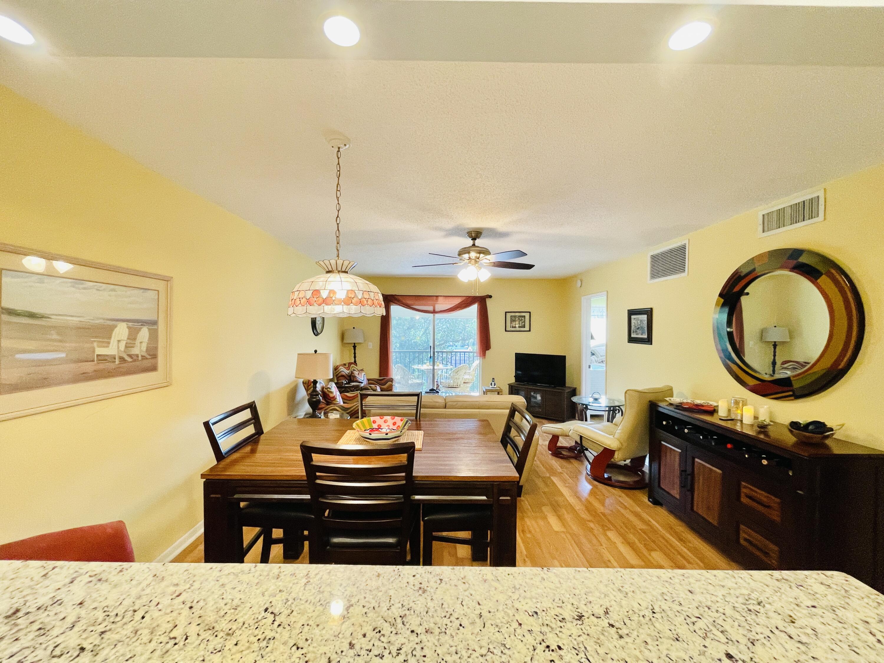 257 South Cypress Road, Unit 442 Pompano Beach, FL 33060 - Photo 7 of 37 a living room with furniture and a fireplace