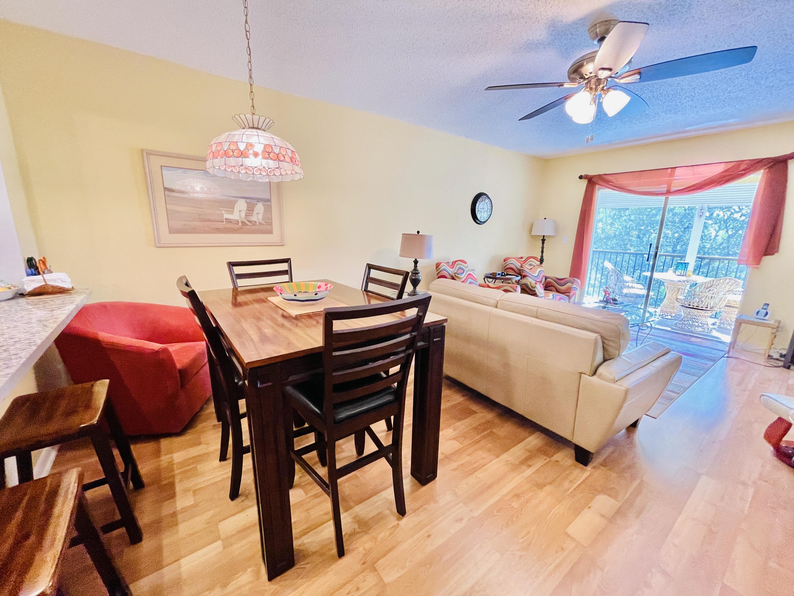 257 South Cypress Road, Unit 442 Pompano Beach, FL 33060 - Photo 9 of 37 a view of a dining room with furniture window and outside view