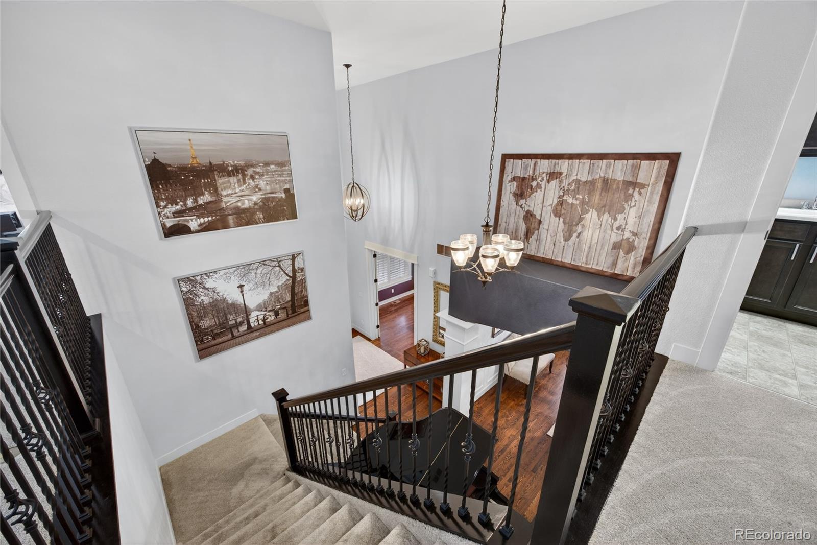 20554 East Shady Ridge Road Parker, CO 80134 - Photo 32 of 49 a view of a hallway with furniture and stairs