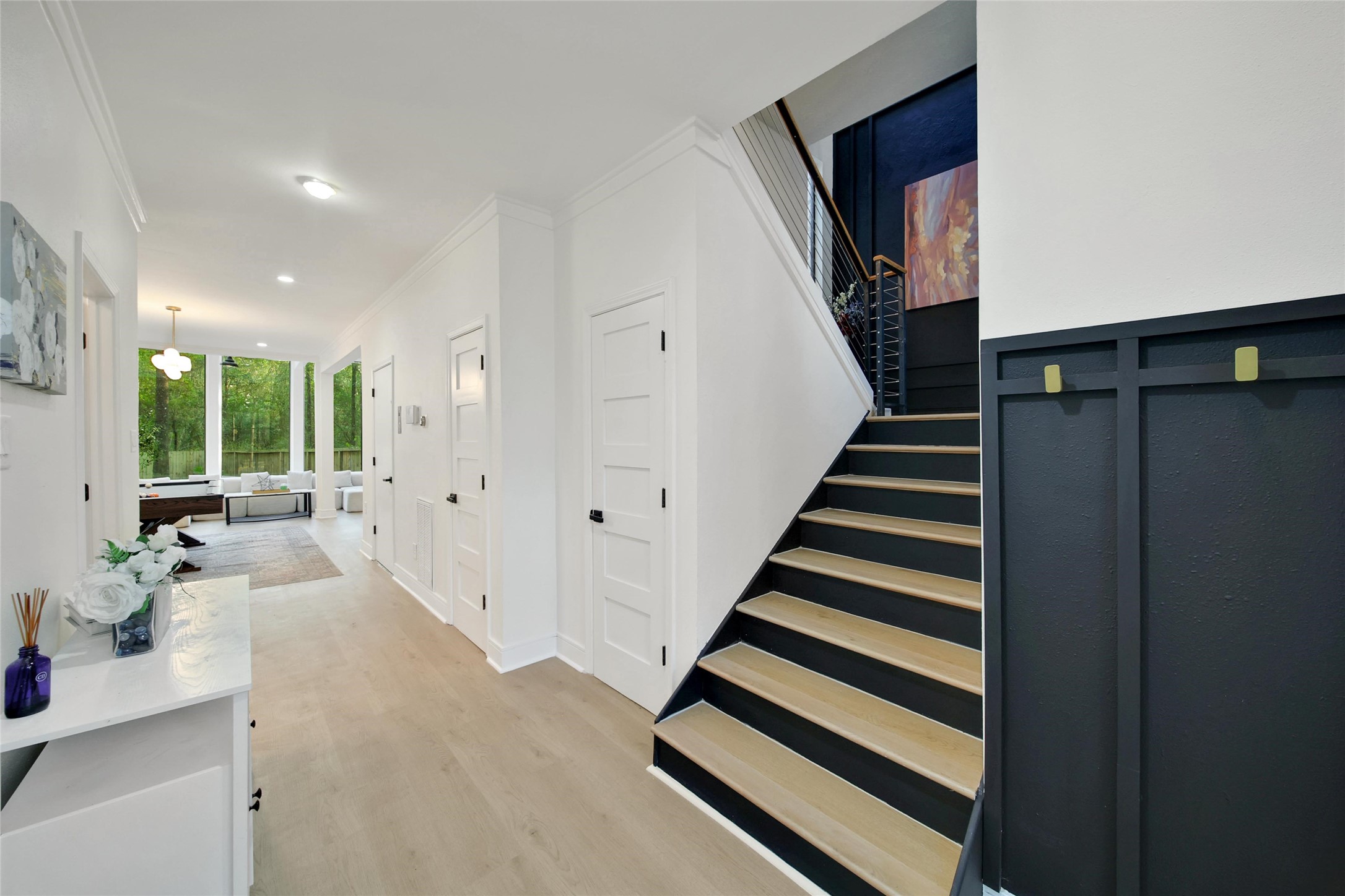 140 South Timber Top Drive Spring, TX 77380 - Photo 25 of 38 a view of a hallway with wooden floor and white walls