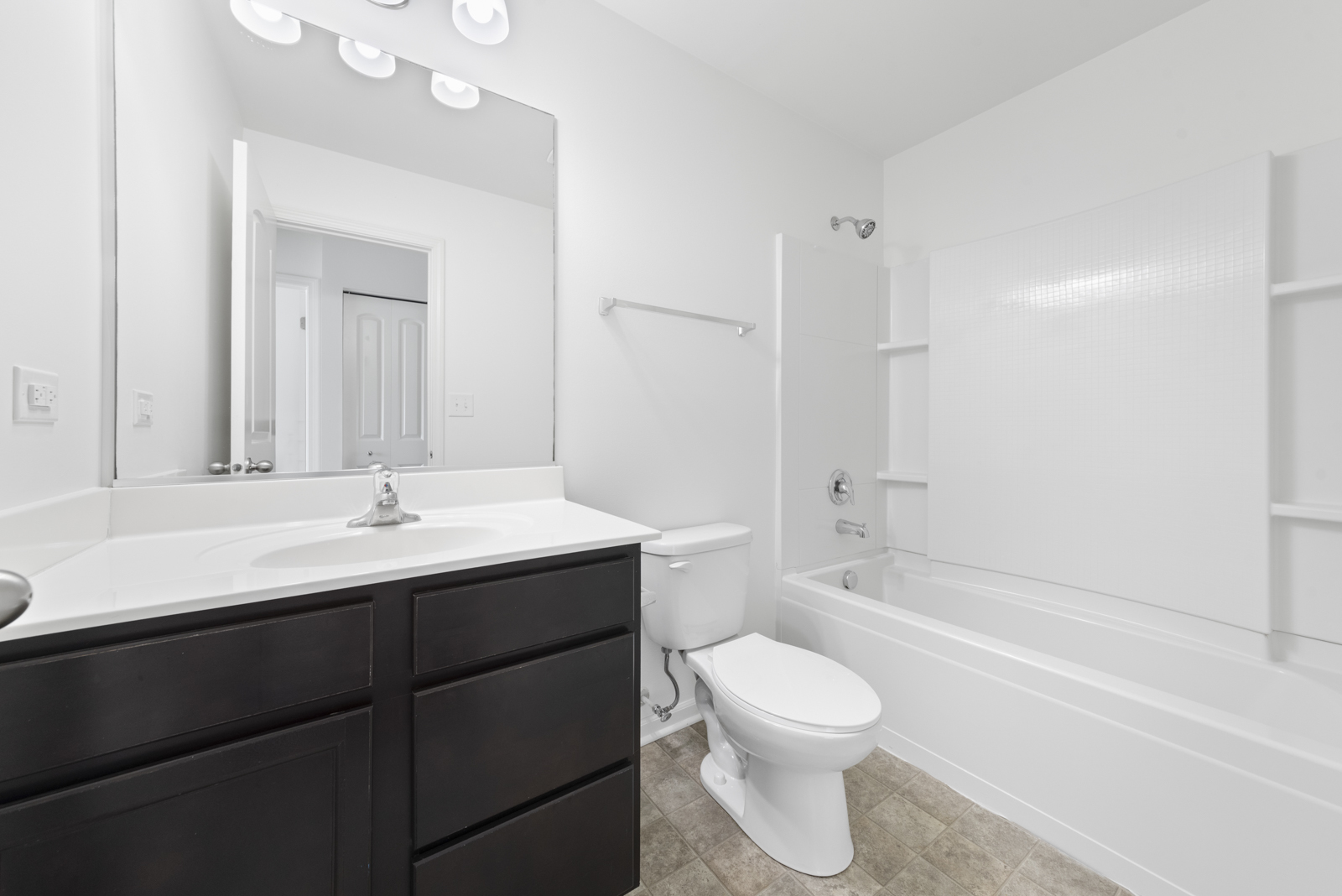 2307 Upland Road Pingree Grove, IL 60140 - Photo 14 of 30 a bathroom with a toilet a sink a mirror a bathtub and vanity