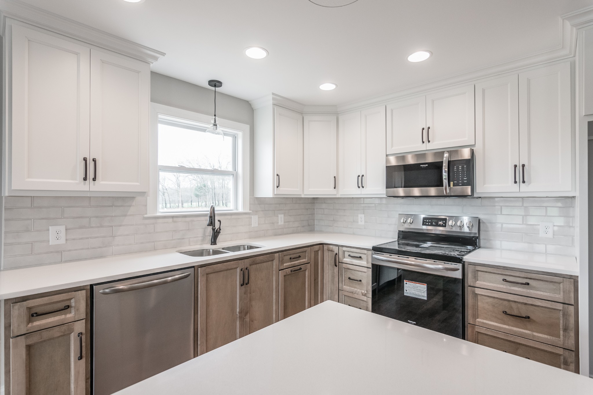 1227 Friendship Road Cross Plains, TN 37049 - Photo 19 of 28 a kitchen with white cabinets appliances a sink and a window