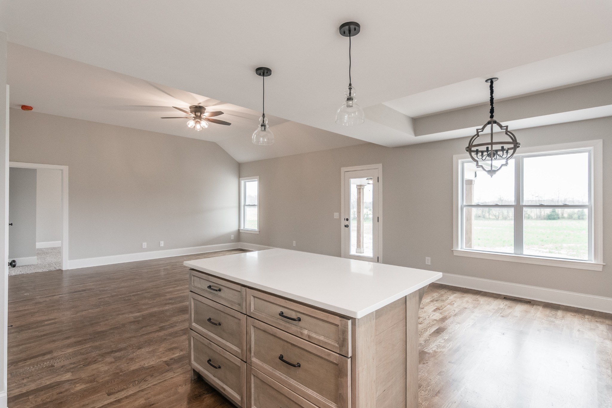 1227 Friendship Road Cross Plains, TN 37049 - Photo 21 of 28 a kitchen with a stove chandelier and wooden floor