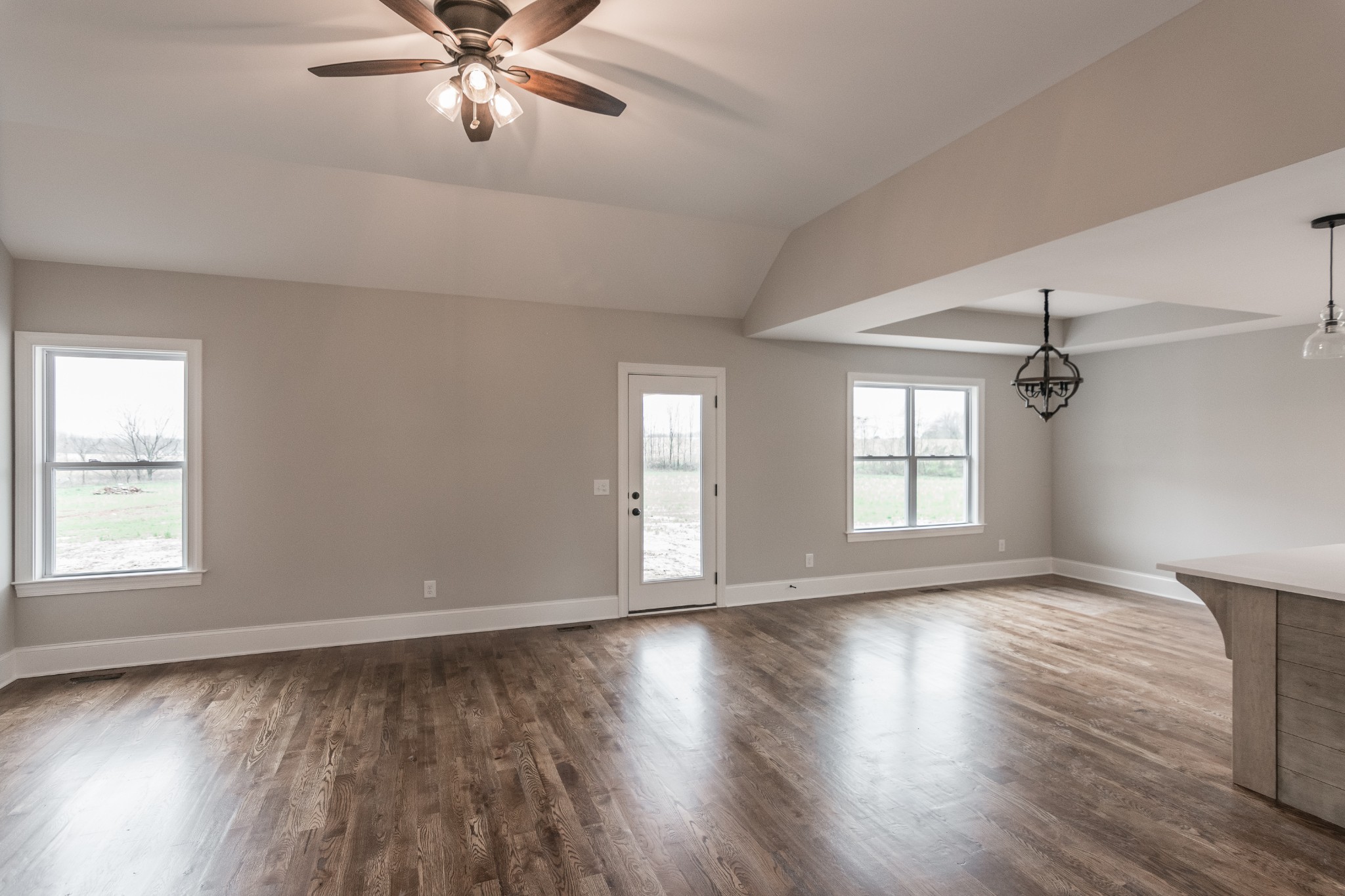1227 Friendship Road Cross Plains, TN 37049 - Photo 7 of 28 a view of an empty room with wooden floor and a window