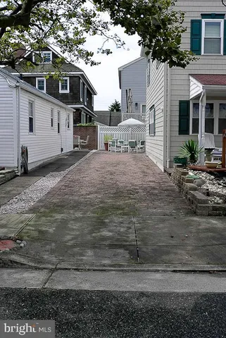 a view of a dining room with furniture and window
