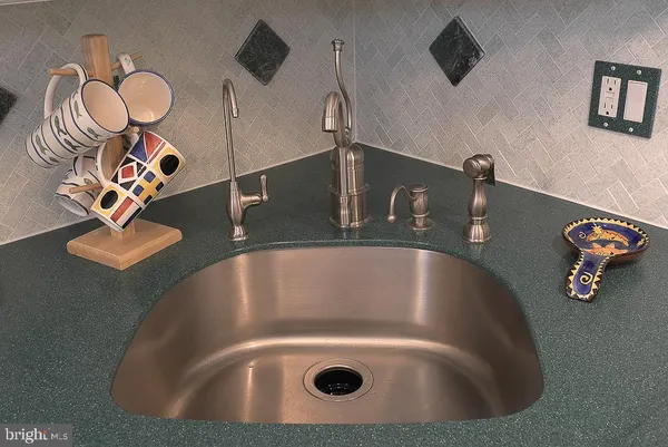 a bathroom with a sink and mirror