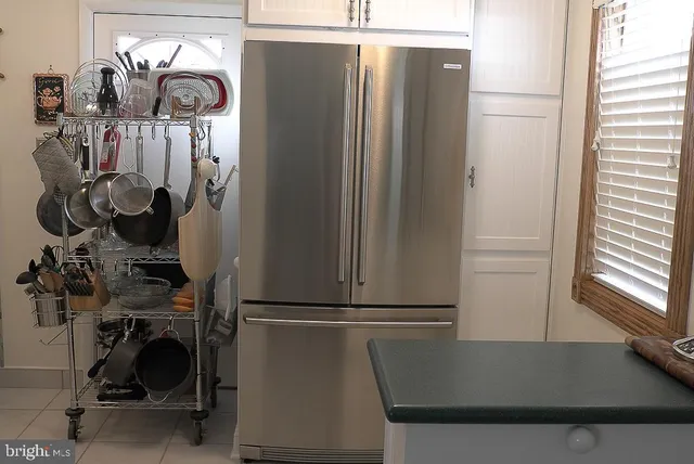 a bedroom with a bed and a mirror