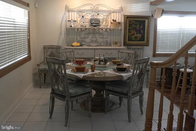 a living room with a flat screen tv and a fireplace
