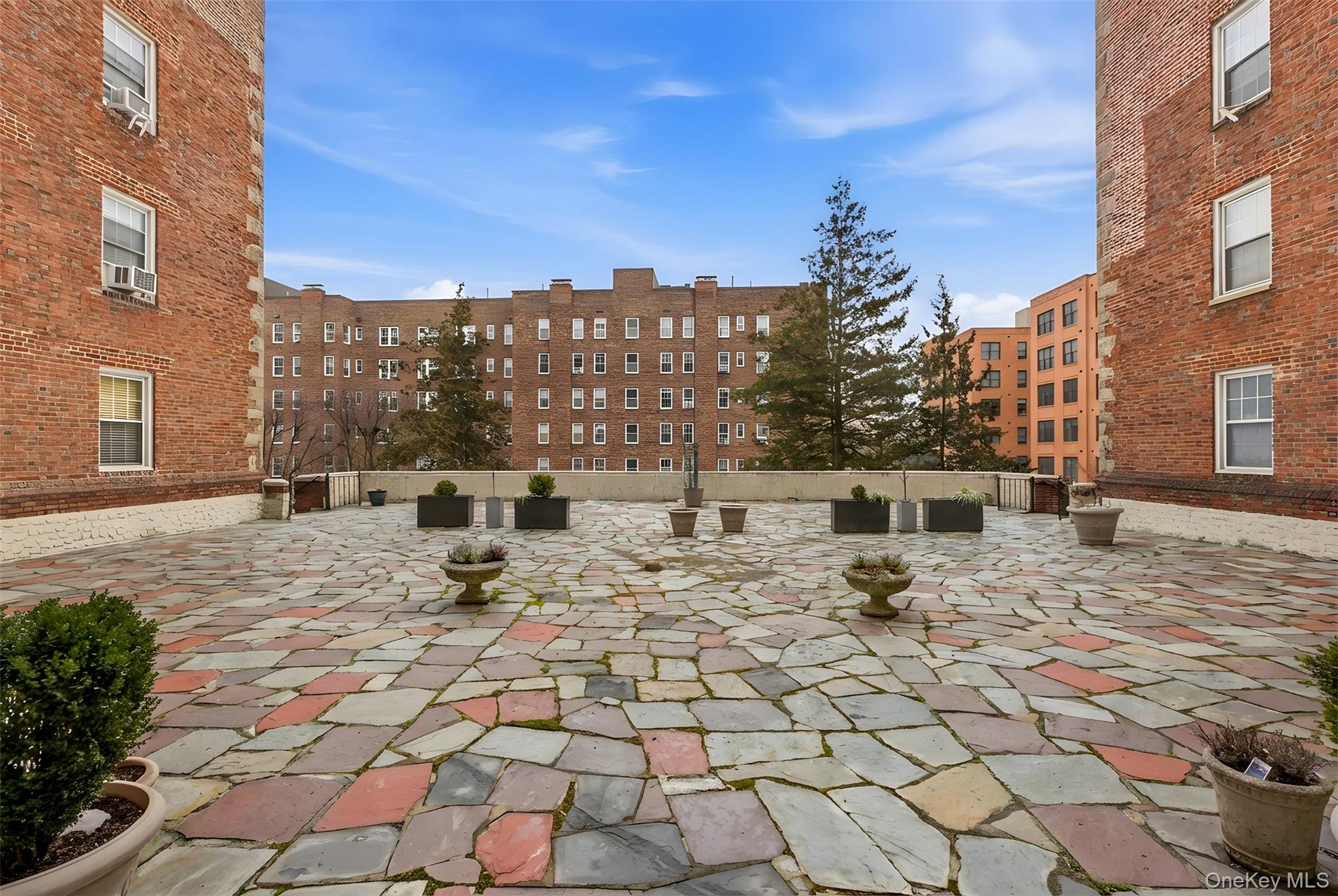 270 Bronxville Road, Unit B22 Bronxville, NY 10708 - Photo 19 of 23 Private courtyard area offers sun chairs and tables in the warmer months