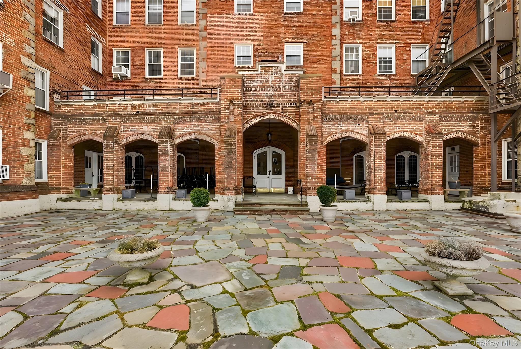 270 Bronxville Road, Unit B22 Bronxville, NY 10708 - Photo 20 of 23 exclusive courtyard has sun chairs and lounge area in the warmer months.
