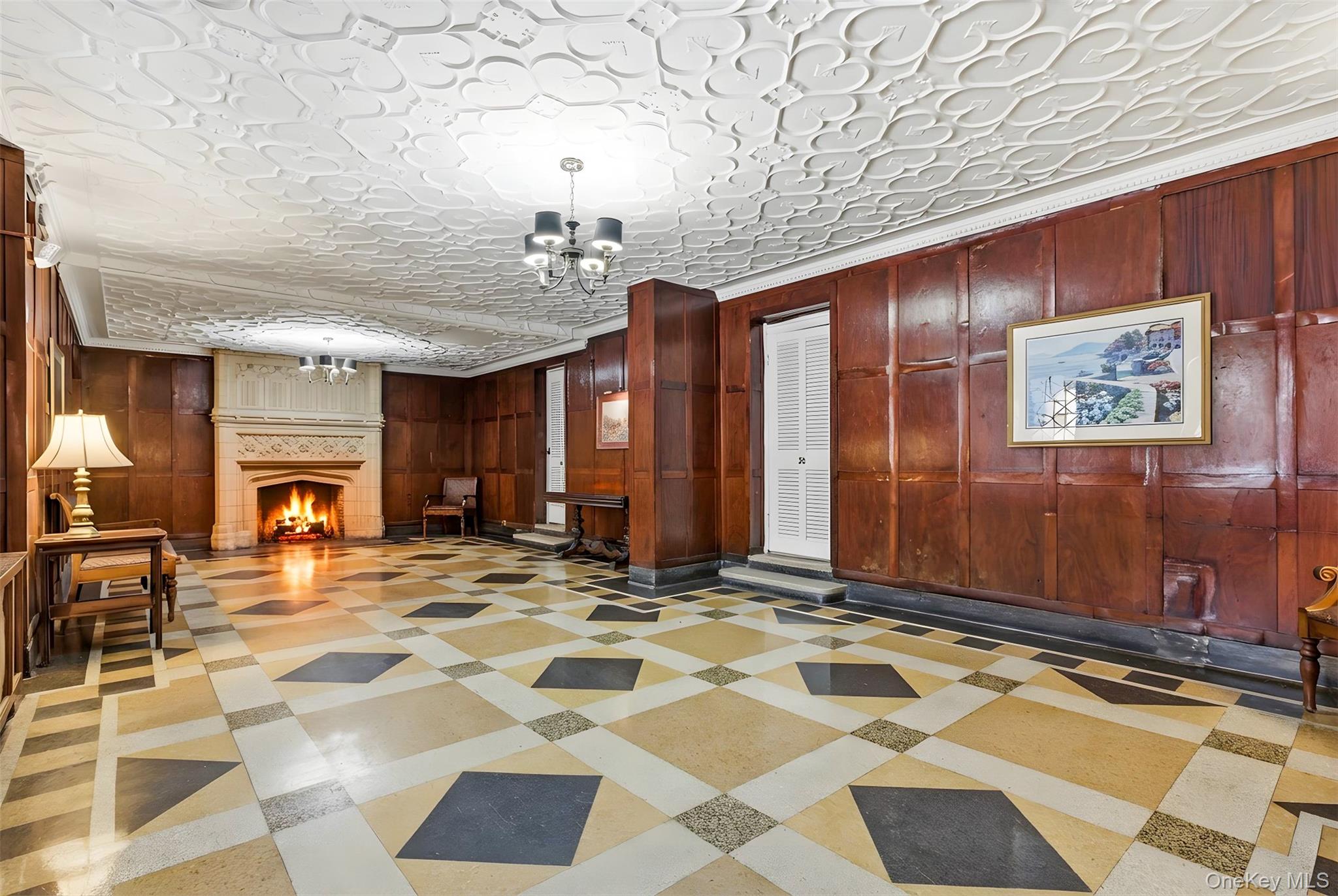 270 Bronxville Road, Unit B22 Bronxville, NY 10708 - Photo 3 of 23 Community lobby featuring wood walls and ornamental molding in classic tudor style