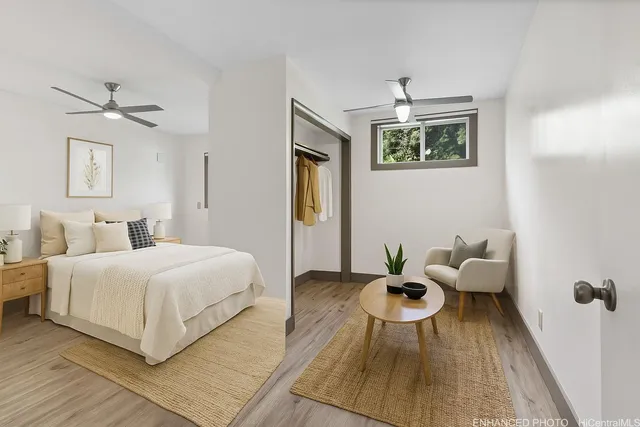 a bedroom with a bed and glass door