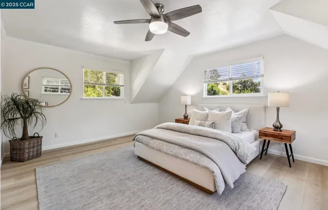 a bedroom with bed and a potted plant