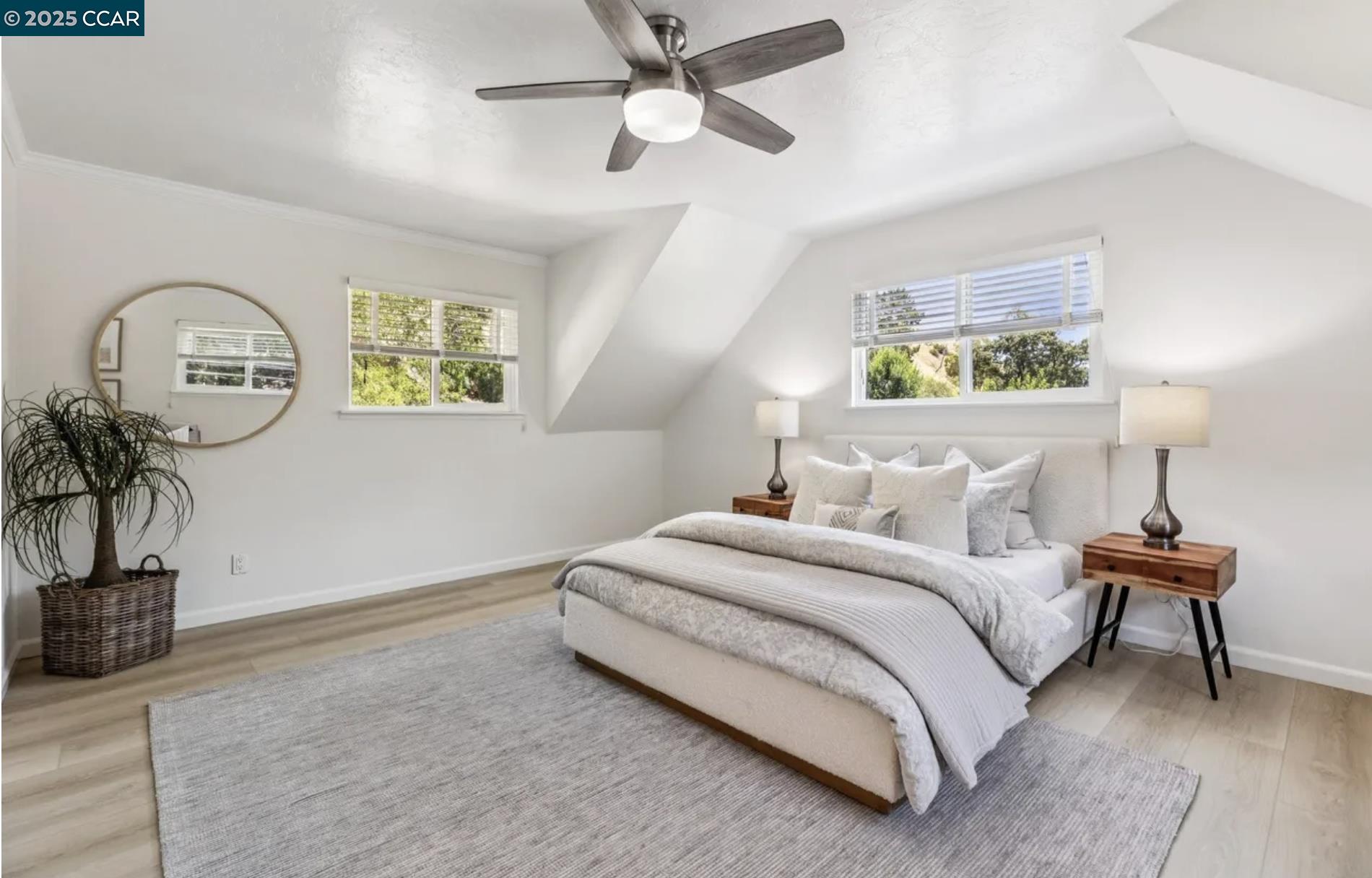 1600 Springbrook Road Walnut Creek, CA 94597 - Photo 16 of 20 a bedroom with bed and a potted plant