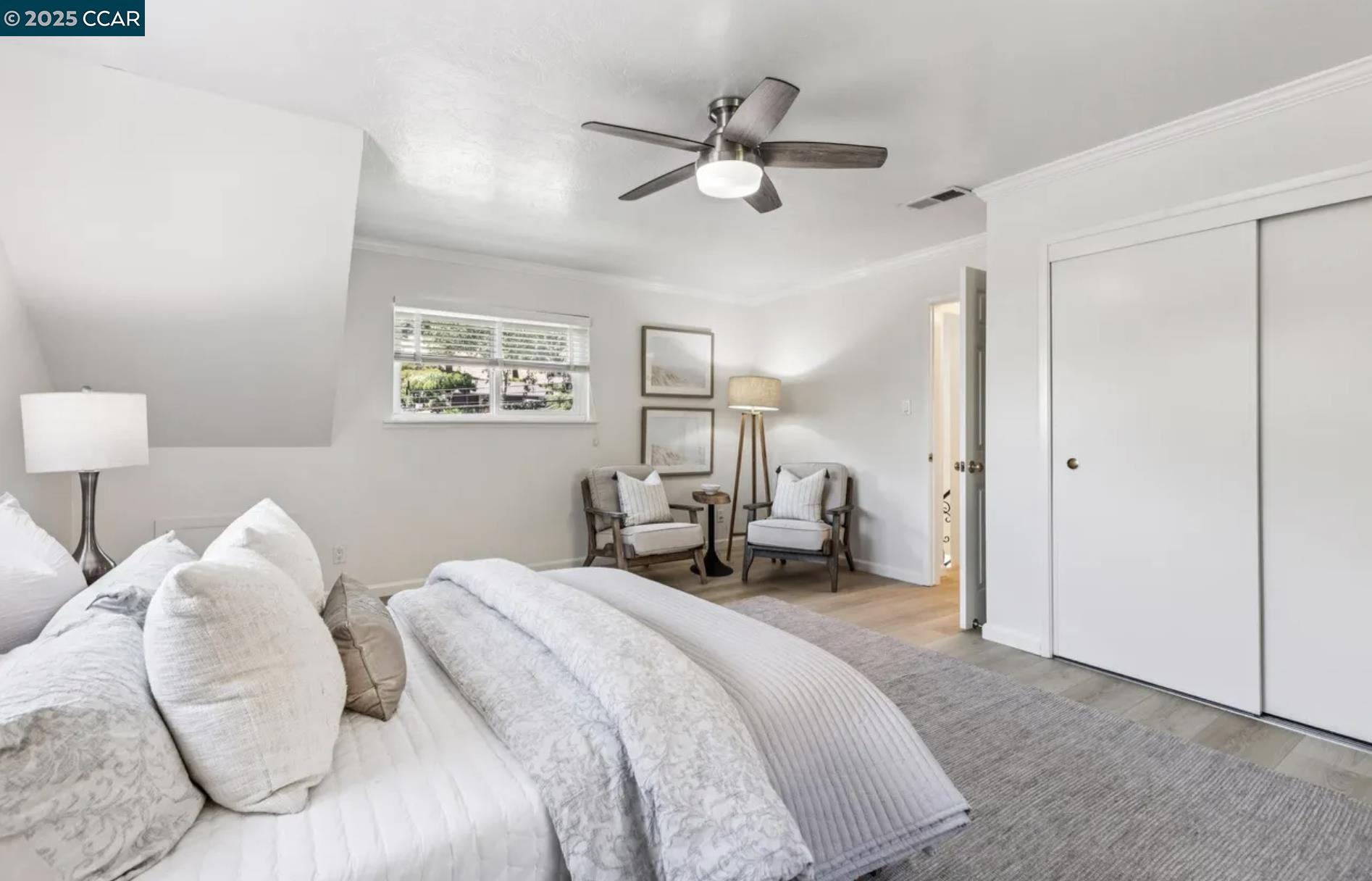 1600 Springbrook Road Walnut Creek, CA 94597 - Photo 17 of 20 a spacious bedroom with a bed and a chandelier