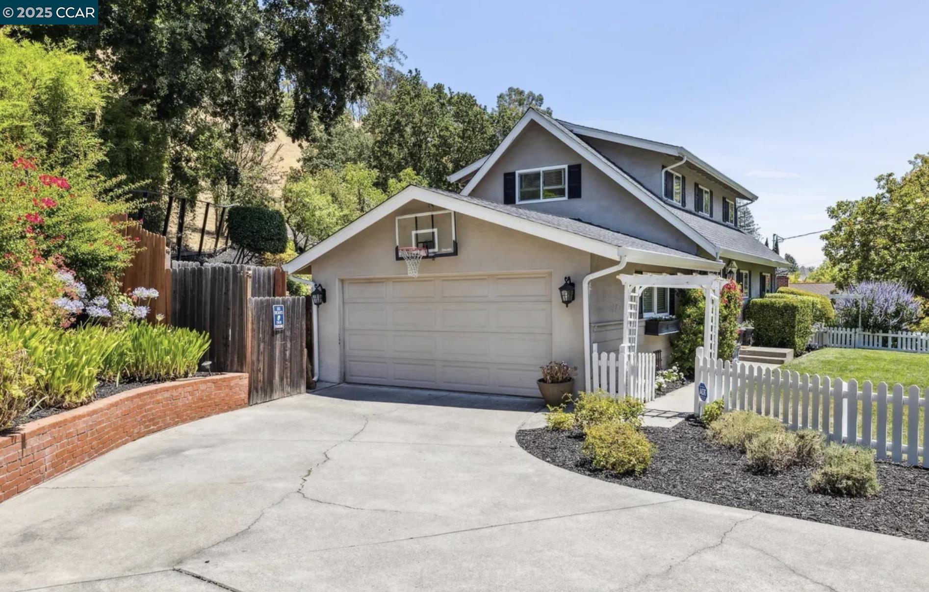 1600 Springbrook Road Walnut Creek, CA 94597 - Photo 3 of 20 a front view of a house with garden
