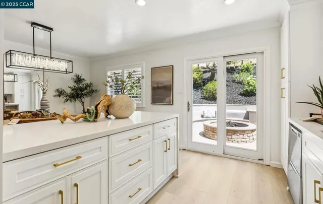 a spacious bathroom with stainless steel appliances double vanity and a mirror