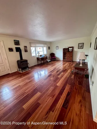a living room with furniture and a rug