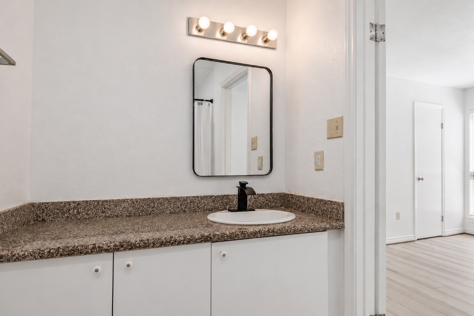 9616 Long Point Road, Unit 63 Houston, TX 77055 - Photo 13 of 17 Beautifully remodeled vanity area with contemporary lighting and finishes.