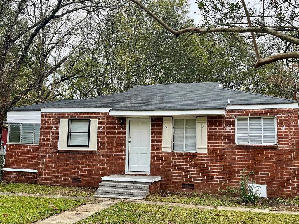 1035 Fisk Avenue Columbus, GA 31906 - Photo 12 of 23 a front view of a house with a garden