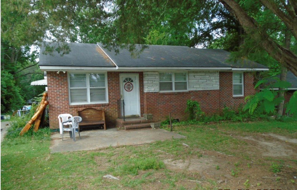 1035 Fisk Avenue Columbus, GA 31906 - Photo 20 of 23 a backyard of a house with table and chairs