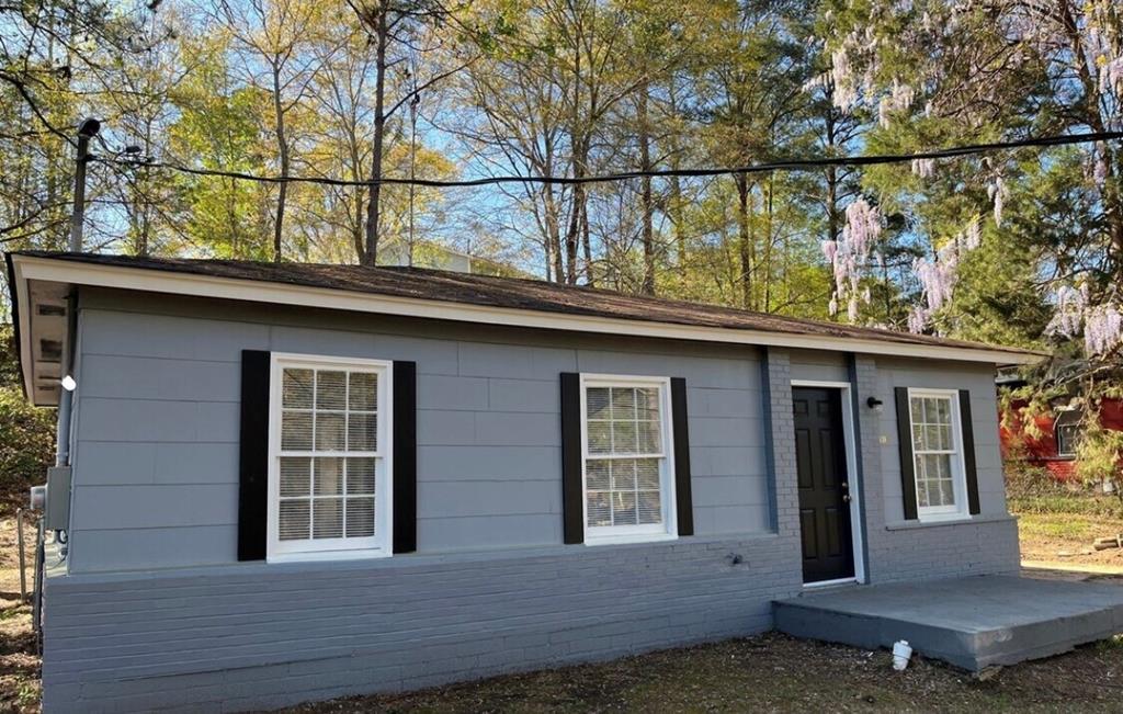 1035 Fisk Avenue Columbus, GA 31906 - Photo 2 of 23 a view of a house with a window and wooden fence