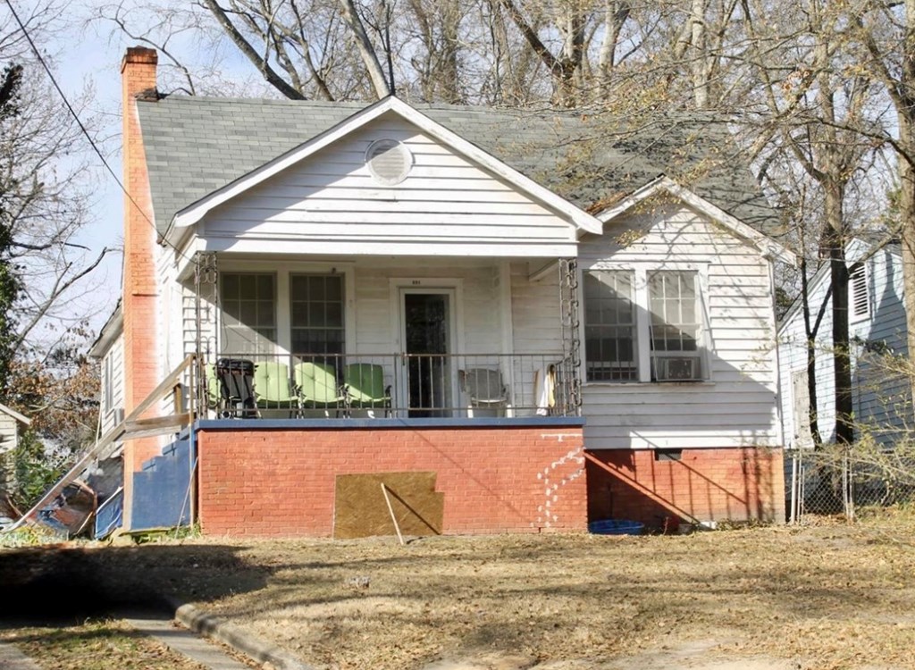 1035 Fisk Avenue Columbus, GA 31906 - Photo 21 of 23 a view of a white house with a large pool and couches chairs