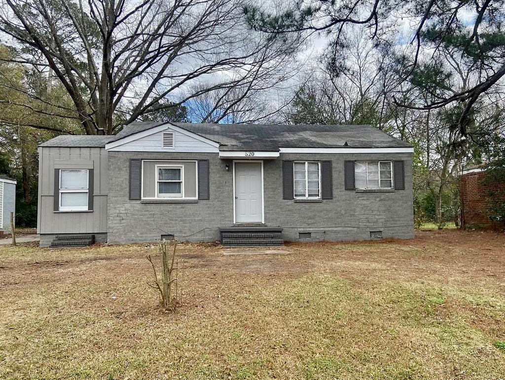 1035 Fisk Avenue Columbus, GA 31906 - Photo 5 of 23 a front view of a house with a yard and garage