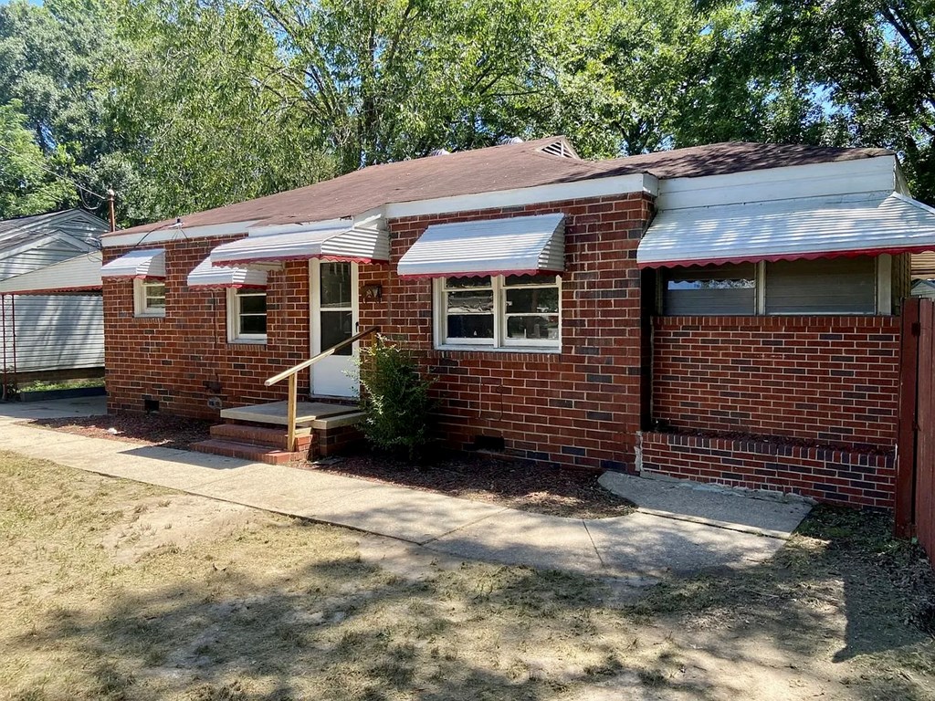 1035 Fisk Avenue Columbus, GA 31906 - Photo 6 of 23 a view of a house with a yard and wooden fence