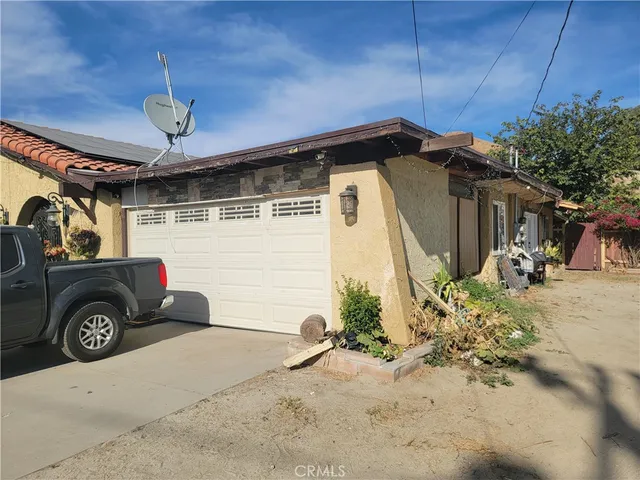 a front view of a house with parking