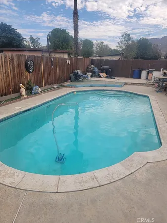 a view of a backyard with sitting area