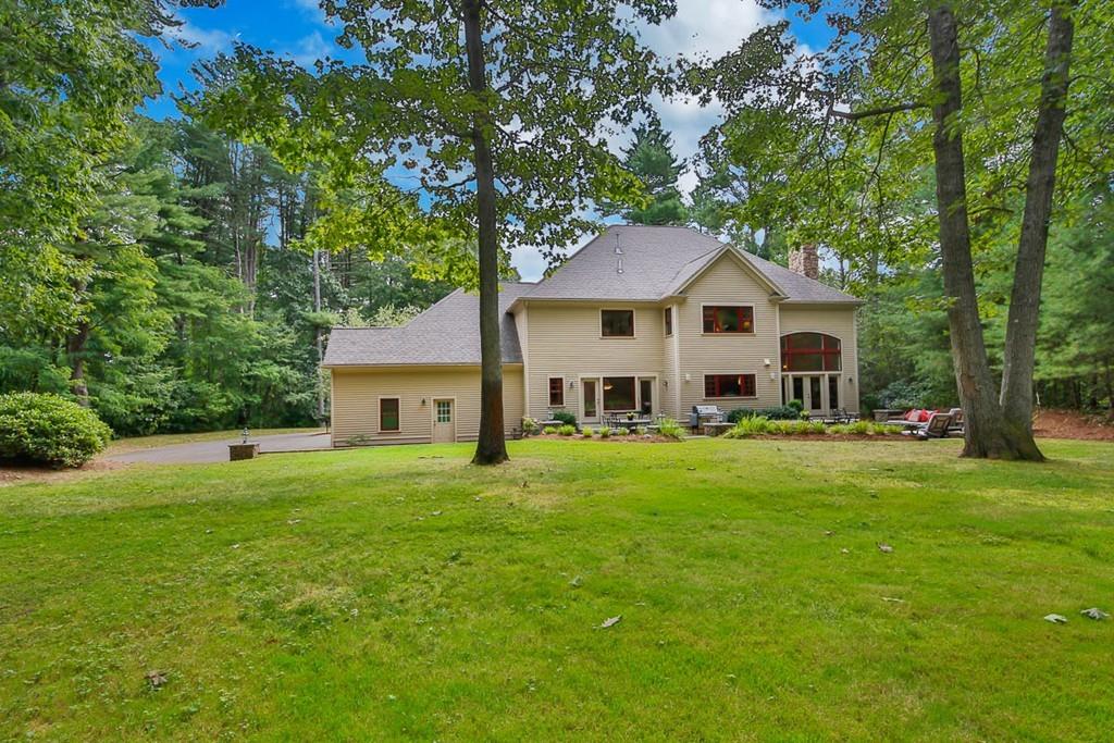 43 Beaver Pond Road Beverly, MA 01915 - Photo 26 of 33 a front view of a house with a yard and trees
