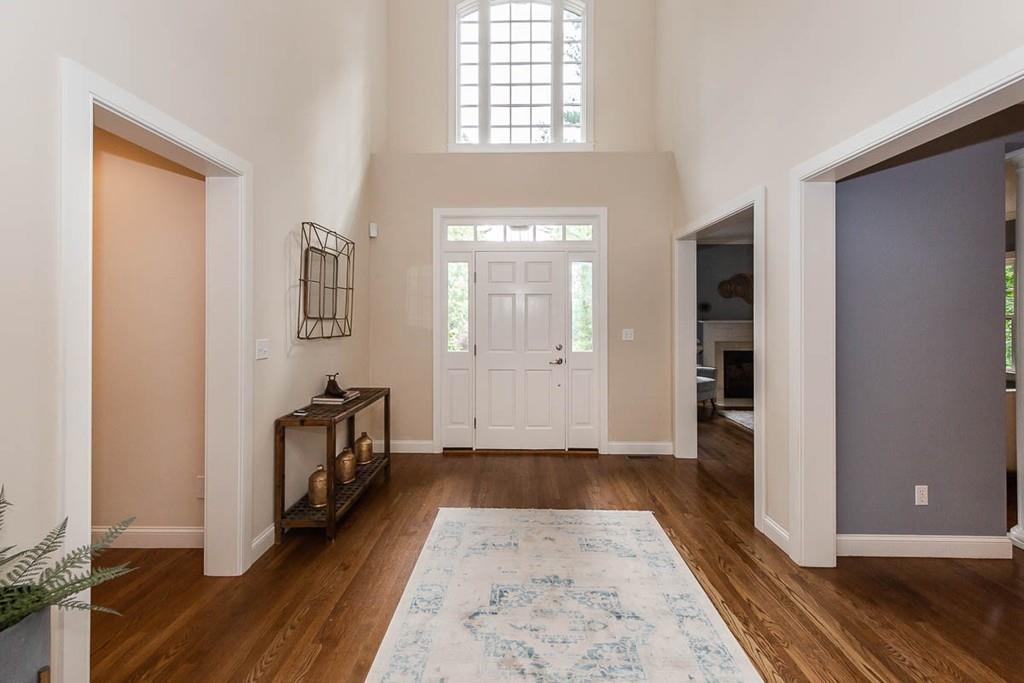 43 Beaver Pond Road Beverly, MA 01915 - Photo 3 of 33 an empty room with wooden floor and windows