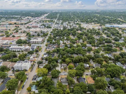 an aerial view of residential house and green space