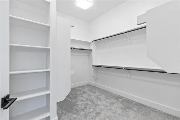 a view of an empty walk in closet