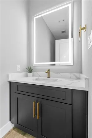 a bathroom with a sink and a mirror