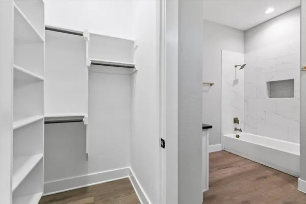 a bathroom with a bathtub sink and toilet