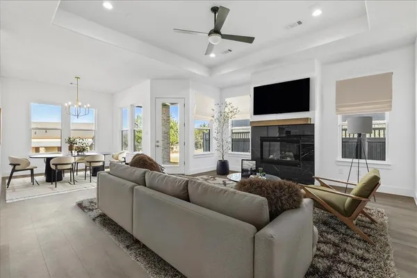 a living room with fireplace furniture and a flat screen tv