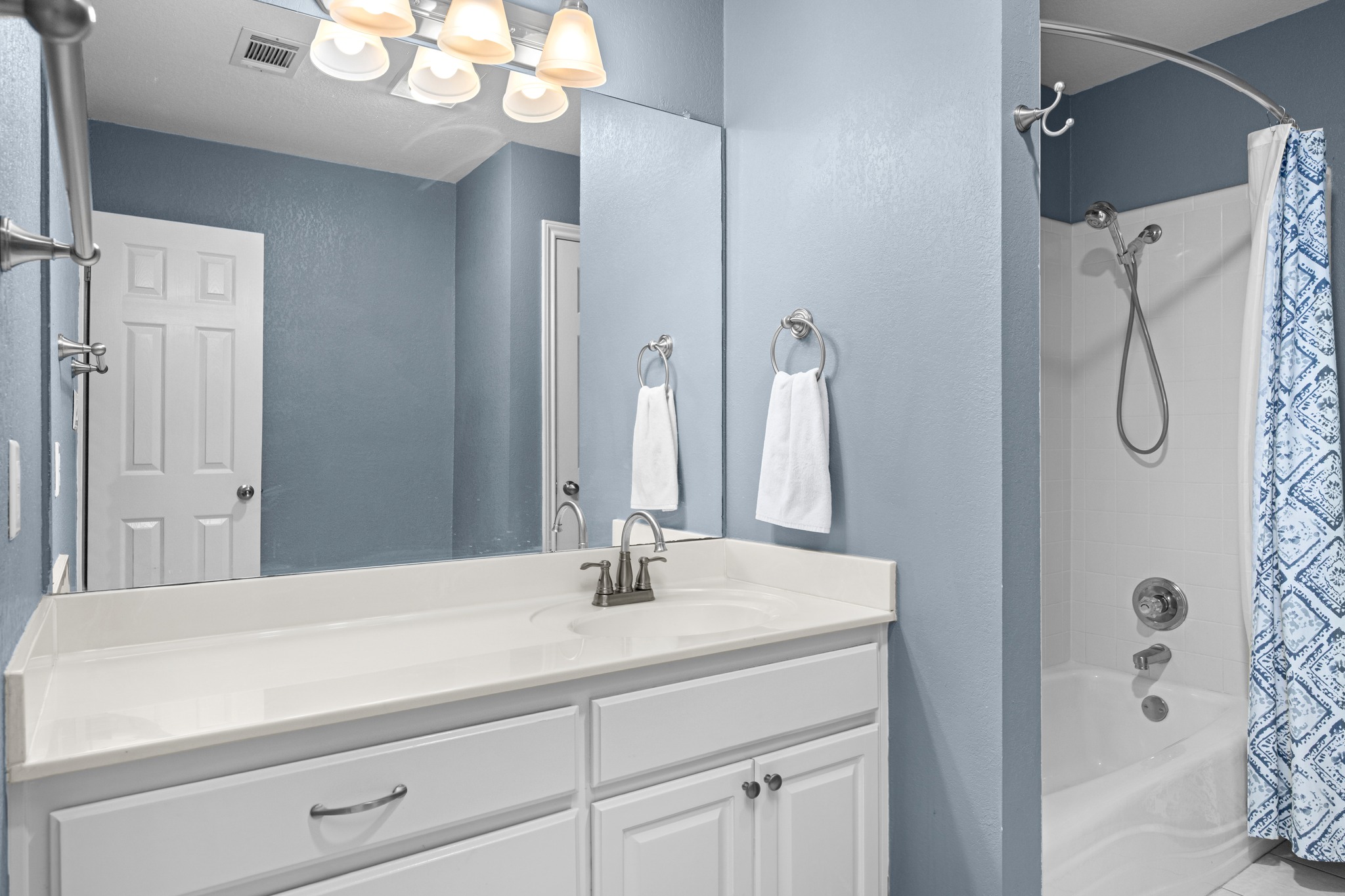 108 Thornwood Road Georgetown, TX 78628 - Photo 33 of 40 A pristine vanity with generous counter space, ideal for daily routines, complements the adjacent shower and bath.