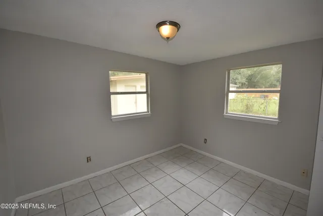 an empty room with windows