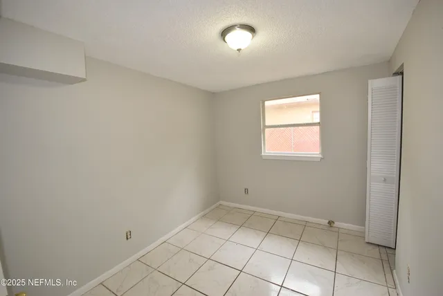 a view of an empty room and window