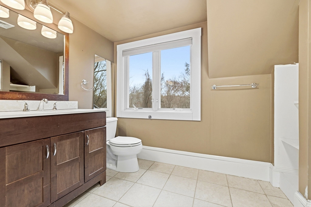 17 Wellesley Street Weston, MA 02493 - Photo 15 of 30 a bathroom with a toilet sink and mirror