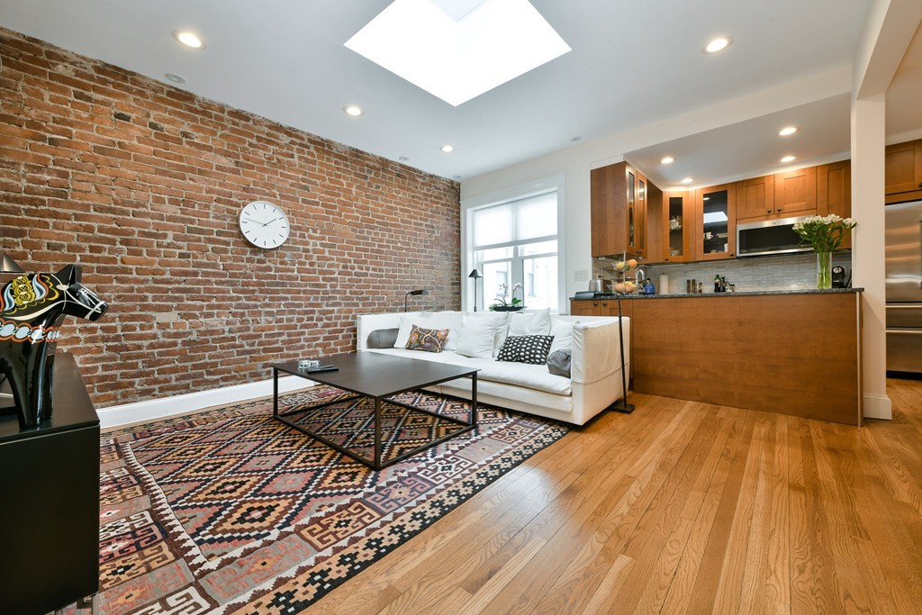 a living room with a wooden floor